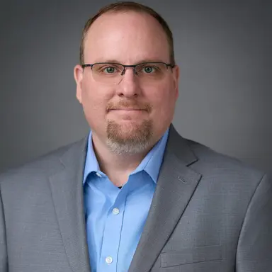 Chris Wilson - Director of Information Security and AI Implementation Expert specializing in enterprise AI adoption, agentic AI security, and compliance frameworks for healthcare and financial services